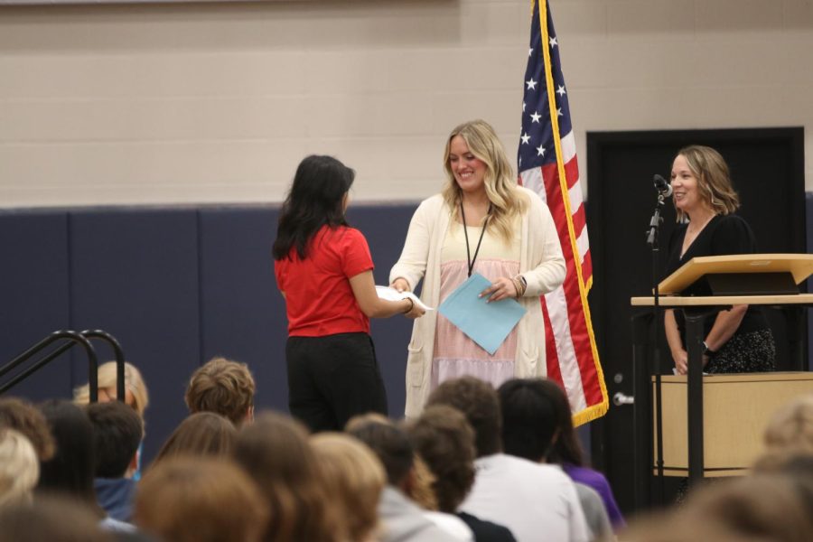 Recipient of the MVHS leadership scholarship, Abhi Raut accepts her award from FACS teacher Lauren Stringer.