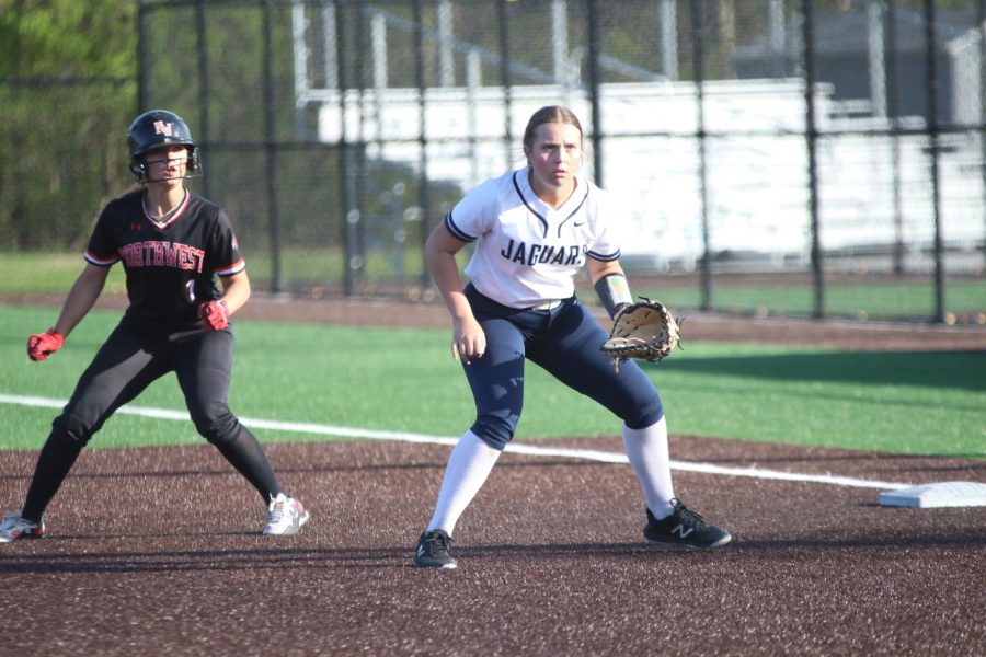 Stationed at first base, junior Elly VanRheen prepares for the batter to hit the ball.