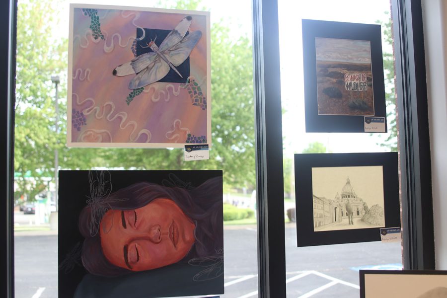 AP Studio Art pieces by seniors Sydney Barge and Ashlyn Elliott are displayed at the art show.

