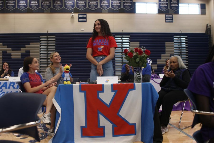 Senior Olivia Page signs to attend the University of Kansas to play collegiate soccer.