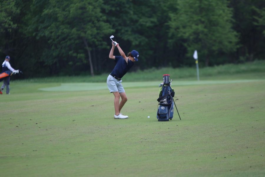 Sophomore Brett Spandet loads to hit the ball toward the green.