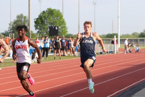 Senior Hayes Miller pumps his arms during the 100 meter dash.