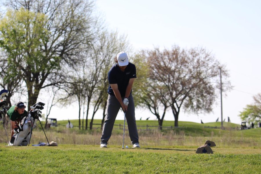 Feet planted, senior Karson Chalupnik prepares to swing. 