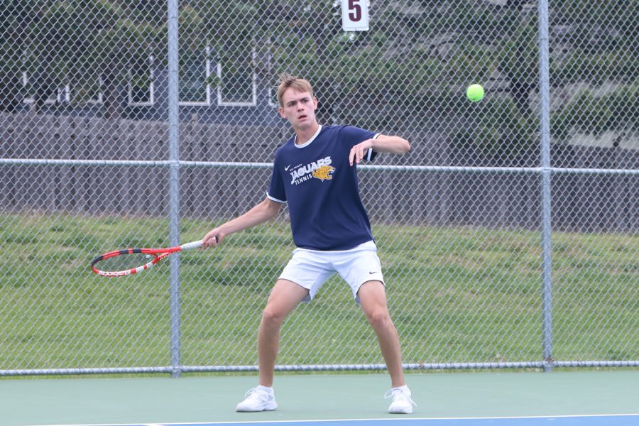 Getting ready to swing, senior Nikola Cubric keeps his eye on the ball.