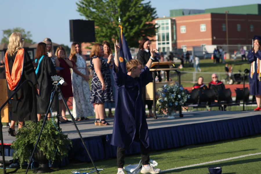 Senior Matt Morgan recovers after cartwheeling and accidentally falling from the stage.