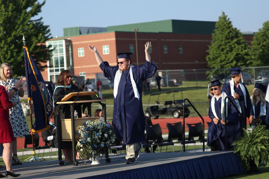 Walking onto the stage after his name was called, senior Dean Sisney happily put his hands in the air. 
