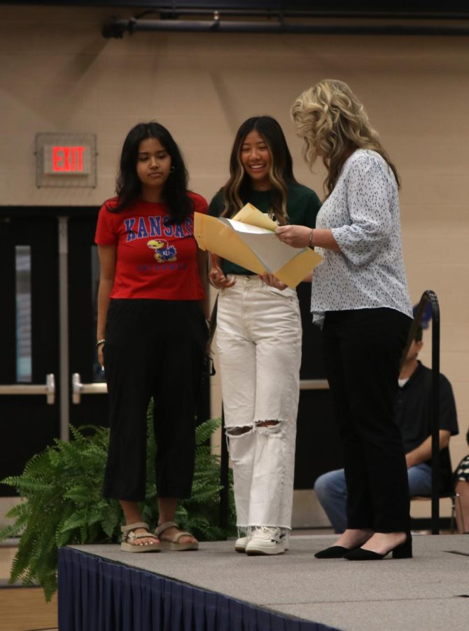 Seniors Abhilasa Raut and Amaiya Manirad receive the Olathe Health System Healthcare Career Scholarship.