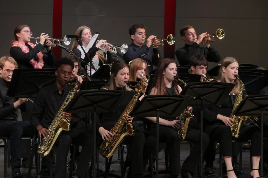 Seniors James Walker and Sienna DelBorrell play tenor saxophone, while senior McKenzie Keltner and junior Kate Marten play the alto saxophone at the spring band concert Tuesday, May 9.