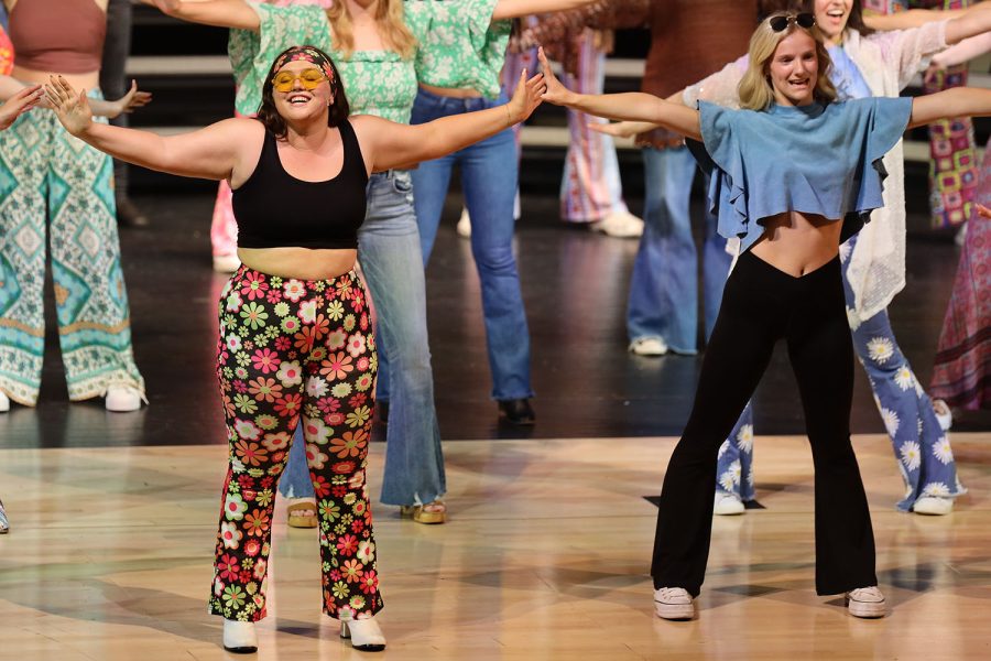 With their arms out, junior McKinley Graves and freshman Brynlee Sword sing along to the song “Dancing Queen” by ABBA.