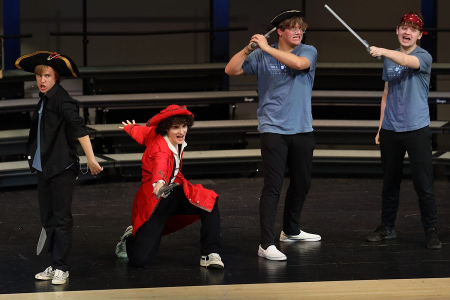 Dressed up as pirates, senior Carter Harvey, senior Brayden Heath, junior Blake Powers and freshman Harrison Guest sing “With Cat-Like Tread” from Pirates of Penzance. 