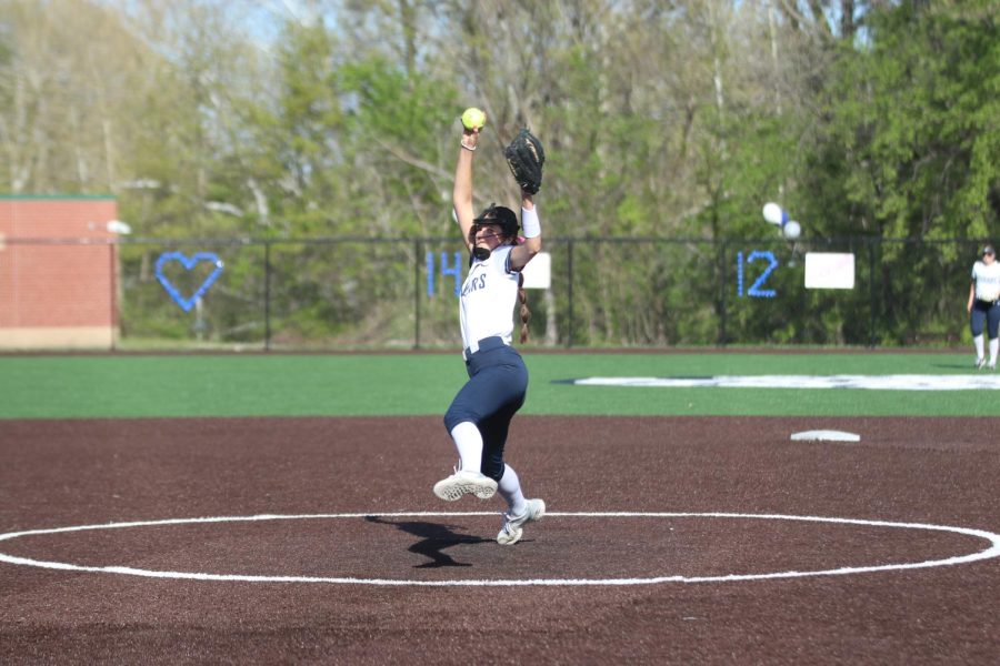 Winding up, sophomore Ashlyn Blazer pitches the ball for a strike. 