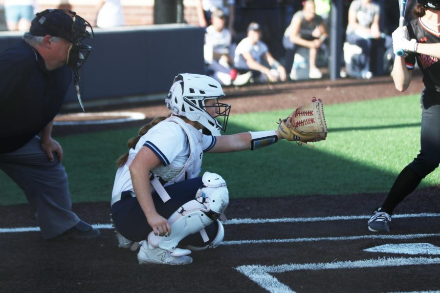 With her arm out, senior Macee Moore gets ready to catch the pitch. 
