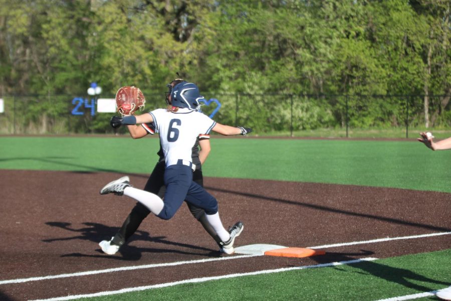 Stretching for first base, sophomore Ashley Bryant touches the base. 