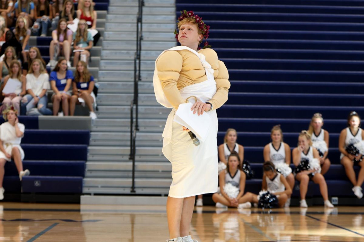 Senior Garrett Cornin poses during the pep assembly as Hercules.