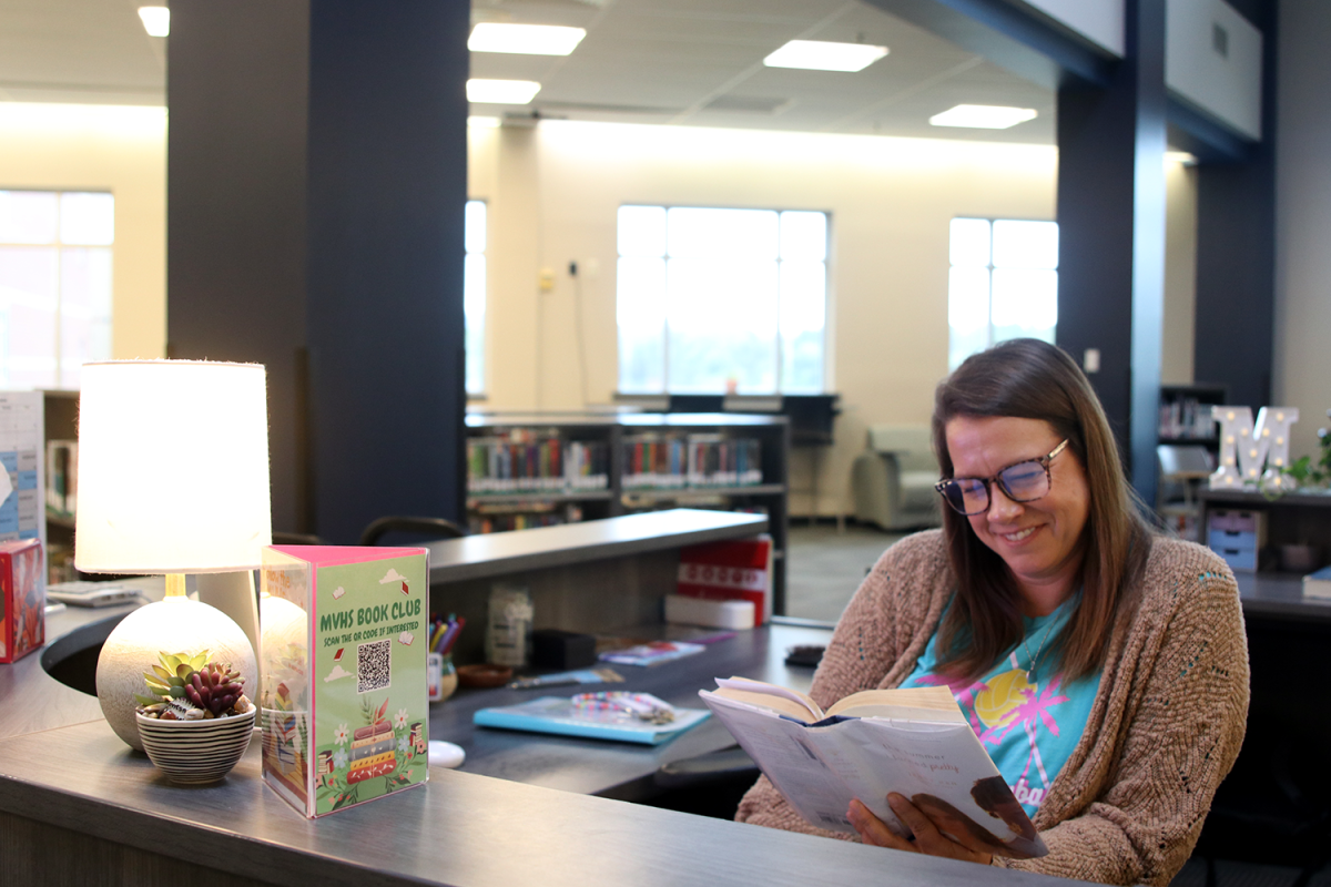 Librarian Ashley Agre enjoys Jenny Han’s “The Summer I Turned Pretty” in the Mill Valley Media Center.
