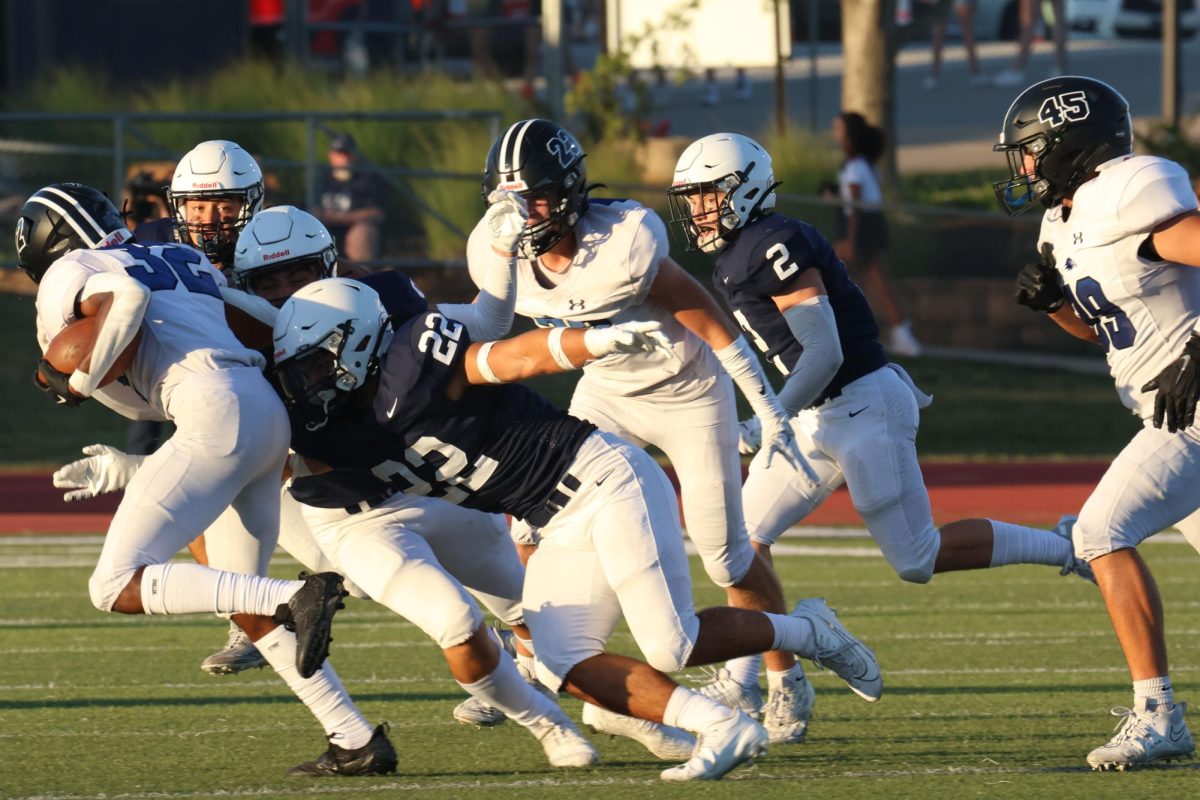 Senior Evan Seifert tackles his opponent. 