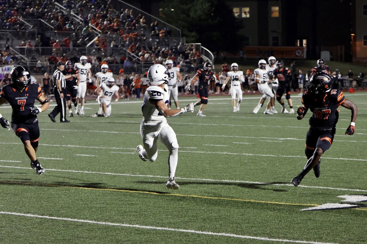 Scanning the sky for the ball, junior Andy Watts awaits the pass as the rest of the field waits for the result.