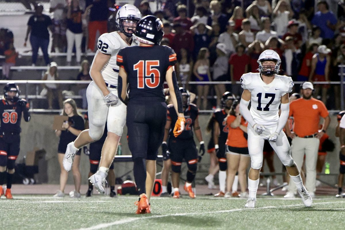 Screaming in the opposing players face, junior Garret Clark lets his opponent know who won the game.