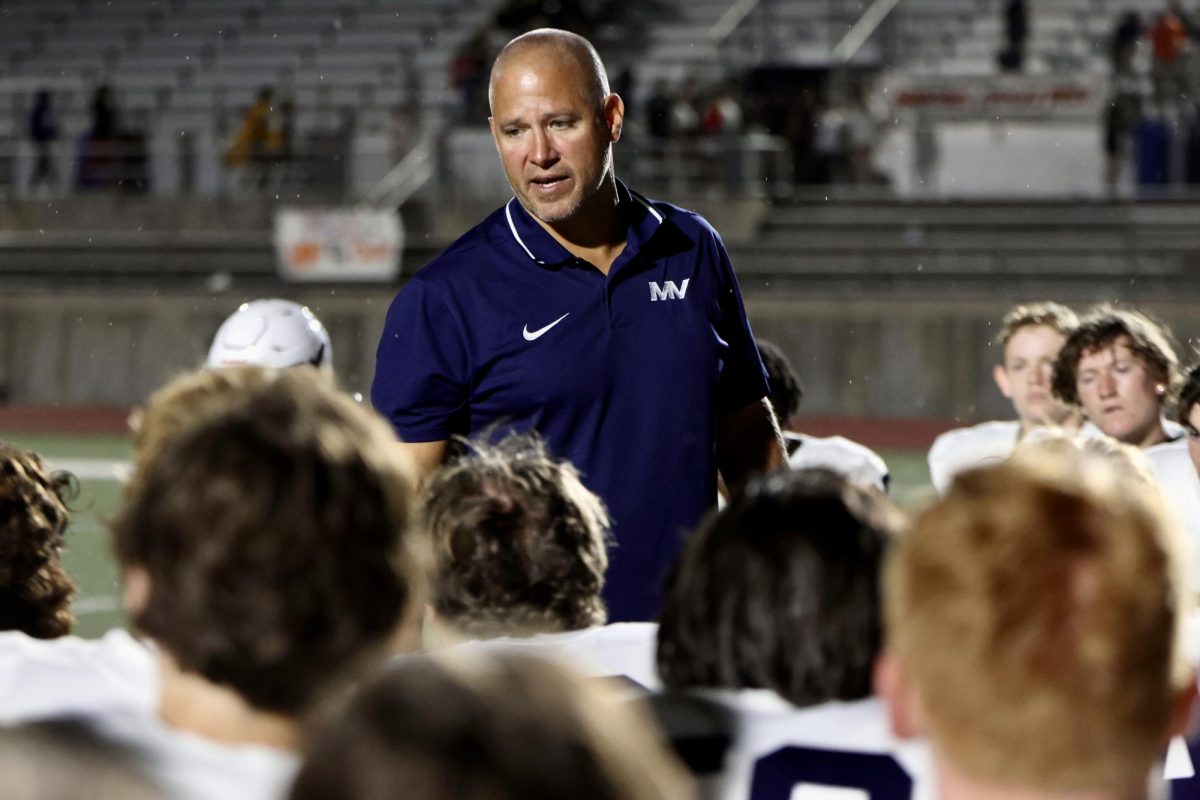 In the post game speech, head coach Joel Applebee congratulates his team on a good win against a solid team.