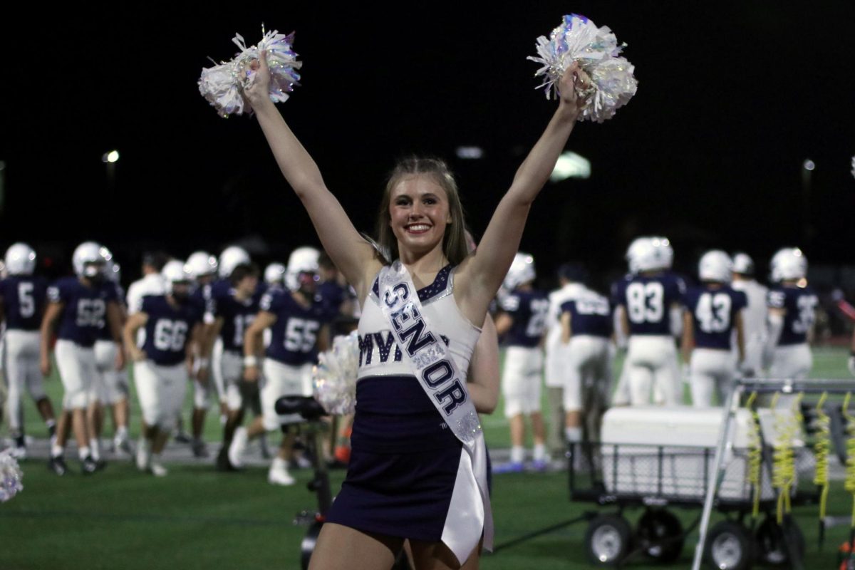 During senior night, senior Halle Wampler strikes a pose. 