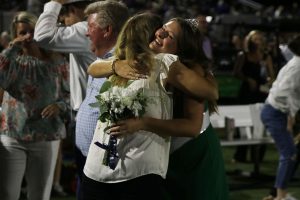 Senior Lucy Roy embraces a hug with her mom after being crowned the 2023 homecoming queen.