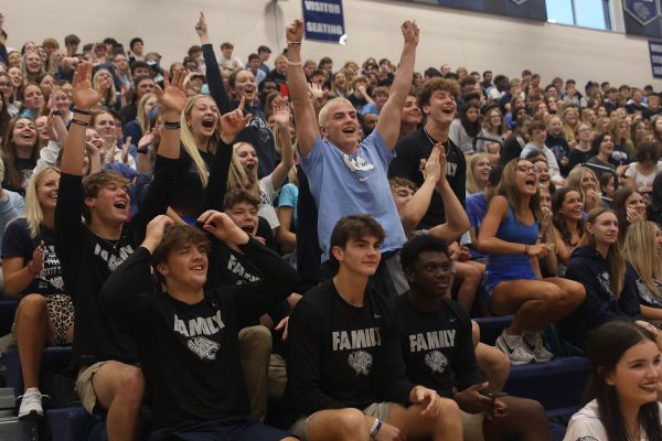Seniors cheer after Homecoming candidates Halle Wampler and Walt Midyett win Tic Tac Toe. 