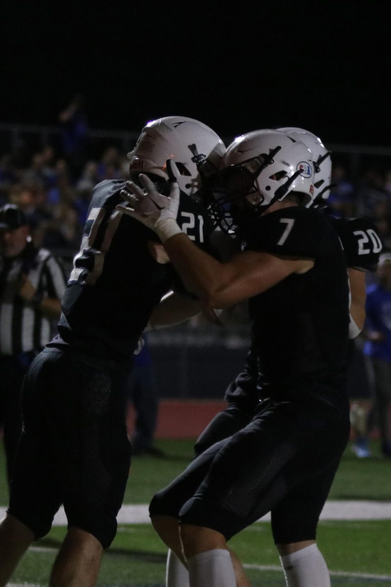 Seniors Tristan Baker and Preston Fischer celebrate together  after a touchdown.