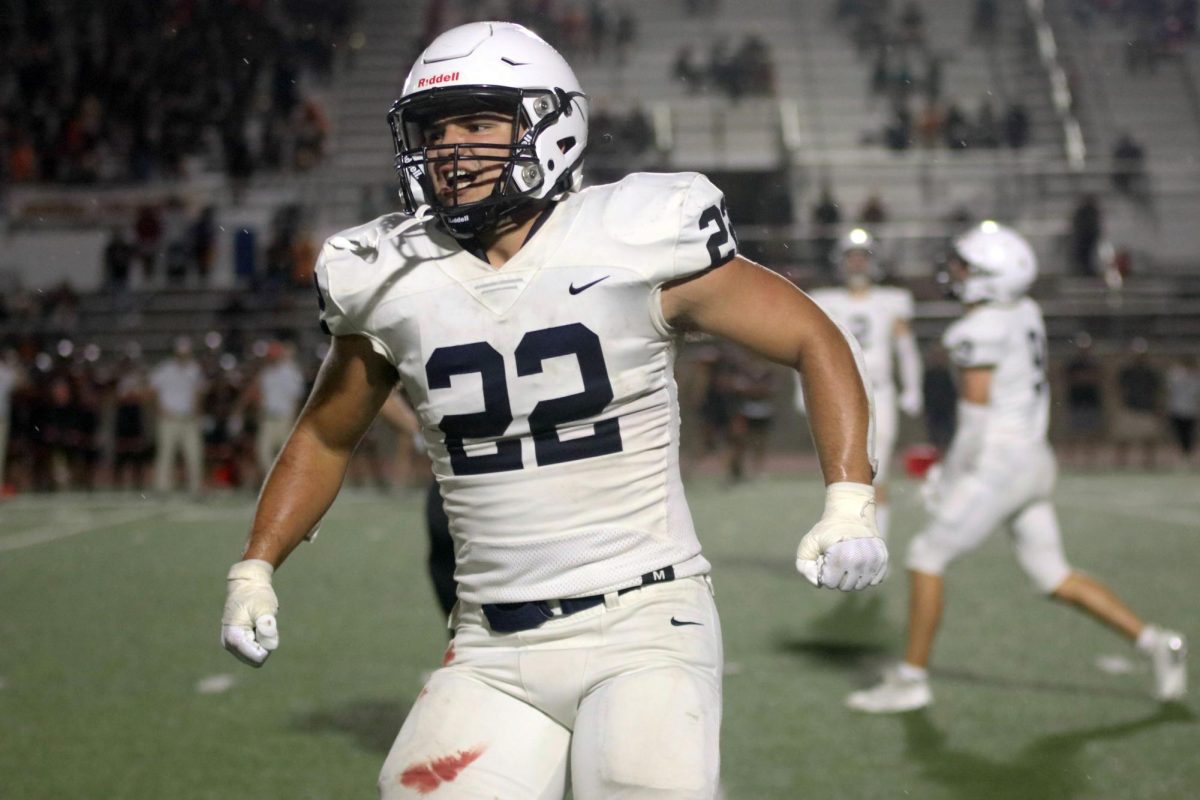 Celebrating a defensive stop senior Evan Seifert yells to the sideline. 