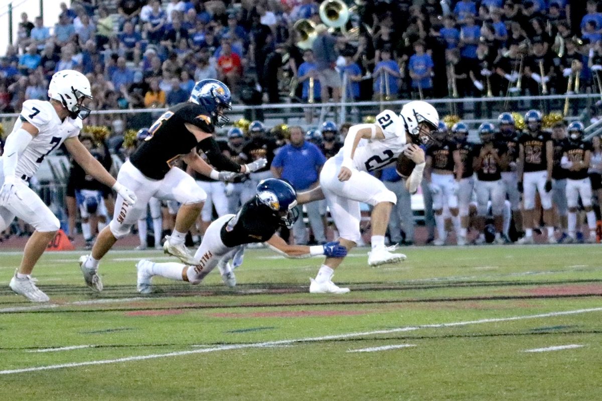 Fighting his way out senior Tristan Baker tries to break free from the defender.