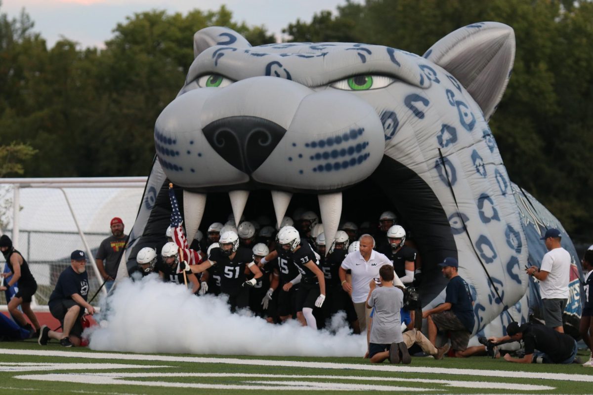 Running out of the tunnel, the team prepares to face their opponent. 