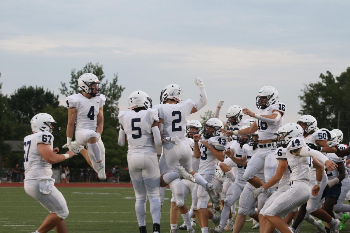 The team gets hype together after the coin toss.