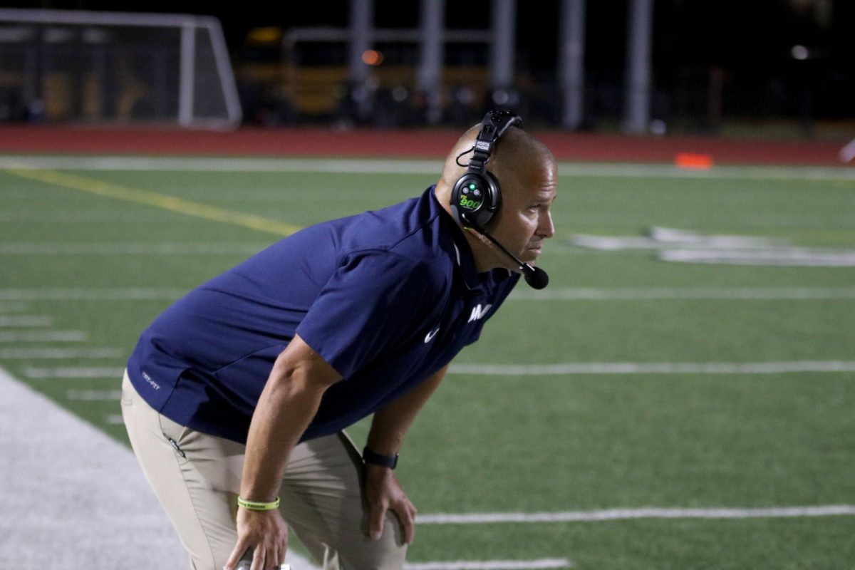 Head Coach Joel Applebee watches the game closely.