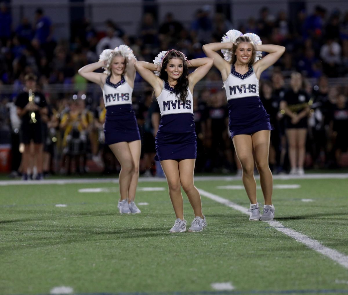 Senior Keira Bret performs along with her teammates during halftime.