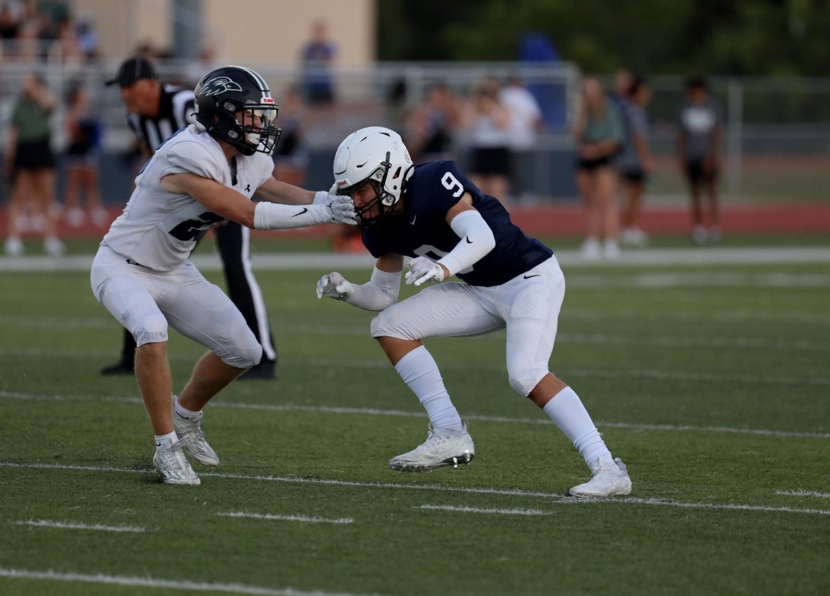 Senior Lincoln Gray avoids the opponent.