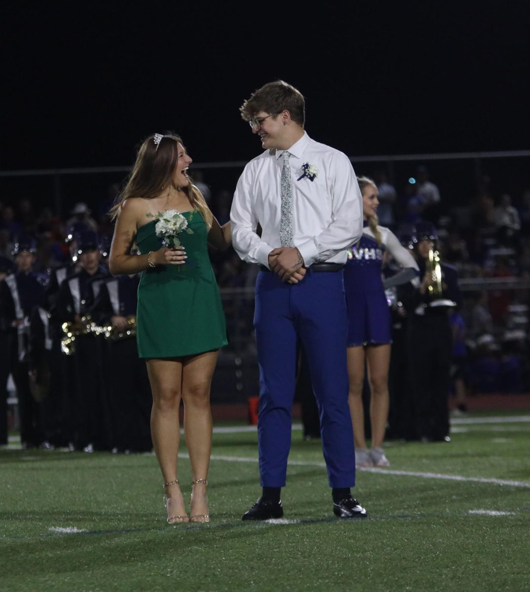 After hearing his name called senior Blake Powers looks to senior Lucy Roy in excitement.
