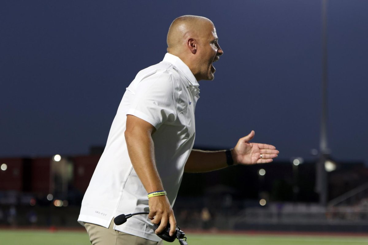 Upset about a penalty, head coach Joel Applebee yells at his players.