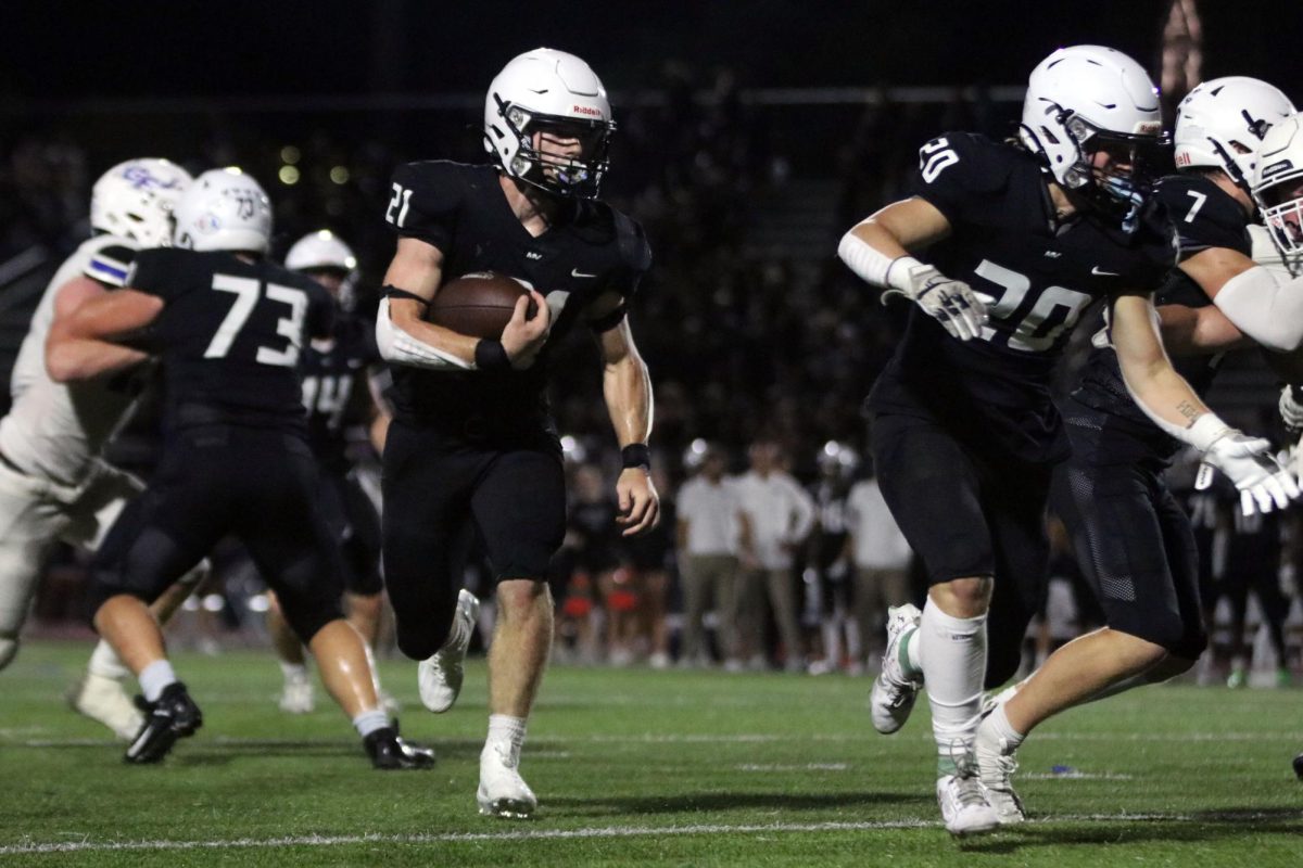 Senior Tristan Baker scans down field for defenders.