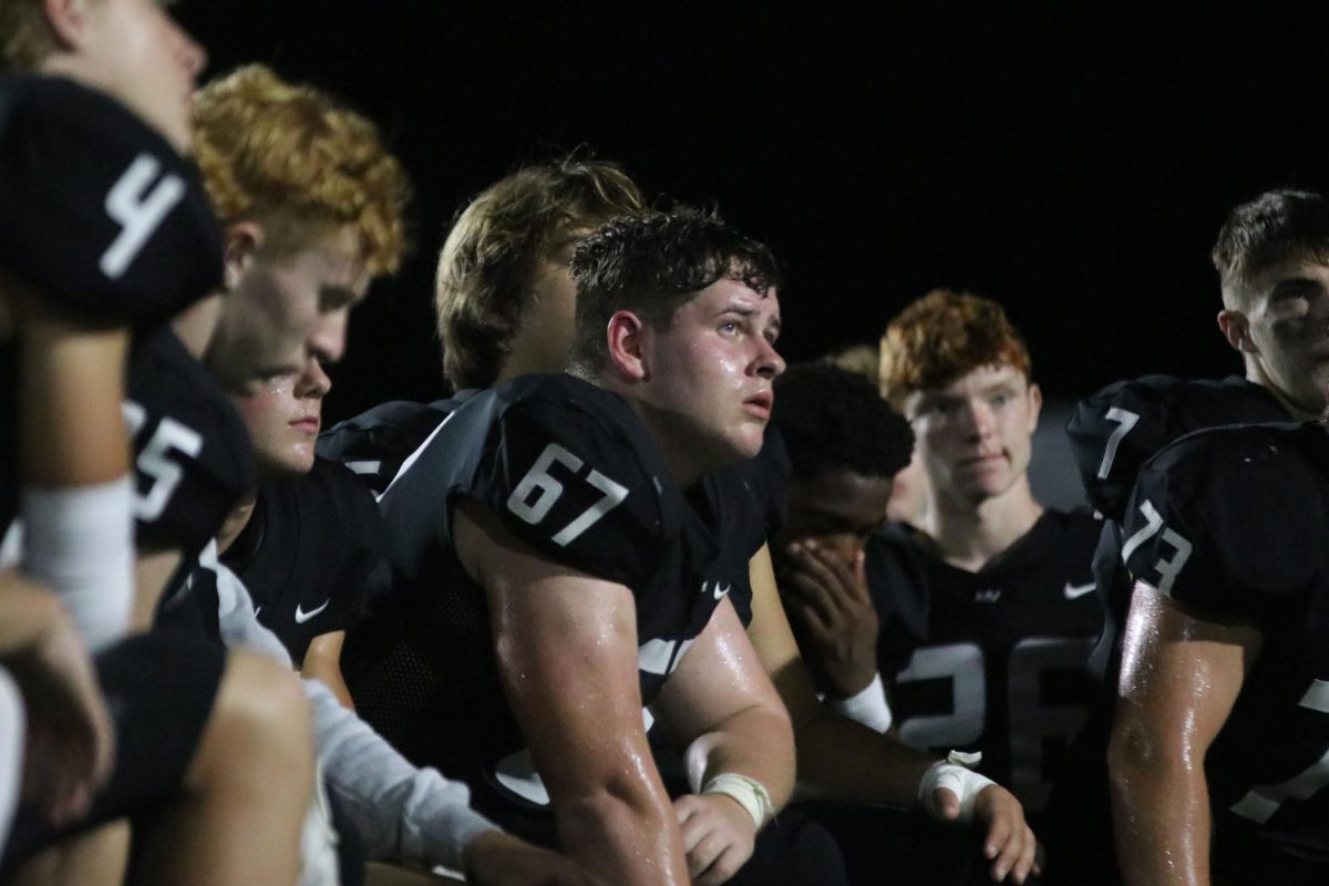 After the game, senior Jack Fulcher listens to the post game speech.