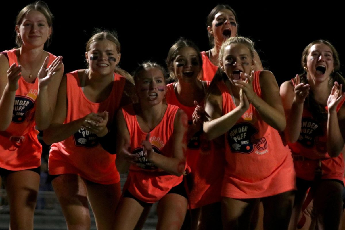 After a defensive stop, a group of juniors celebrates. 