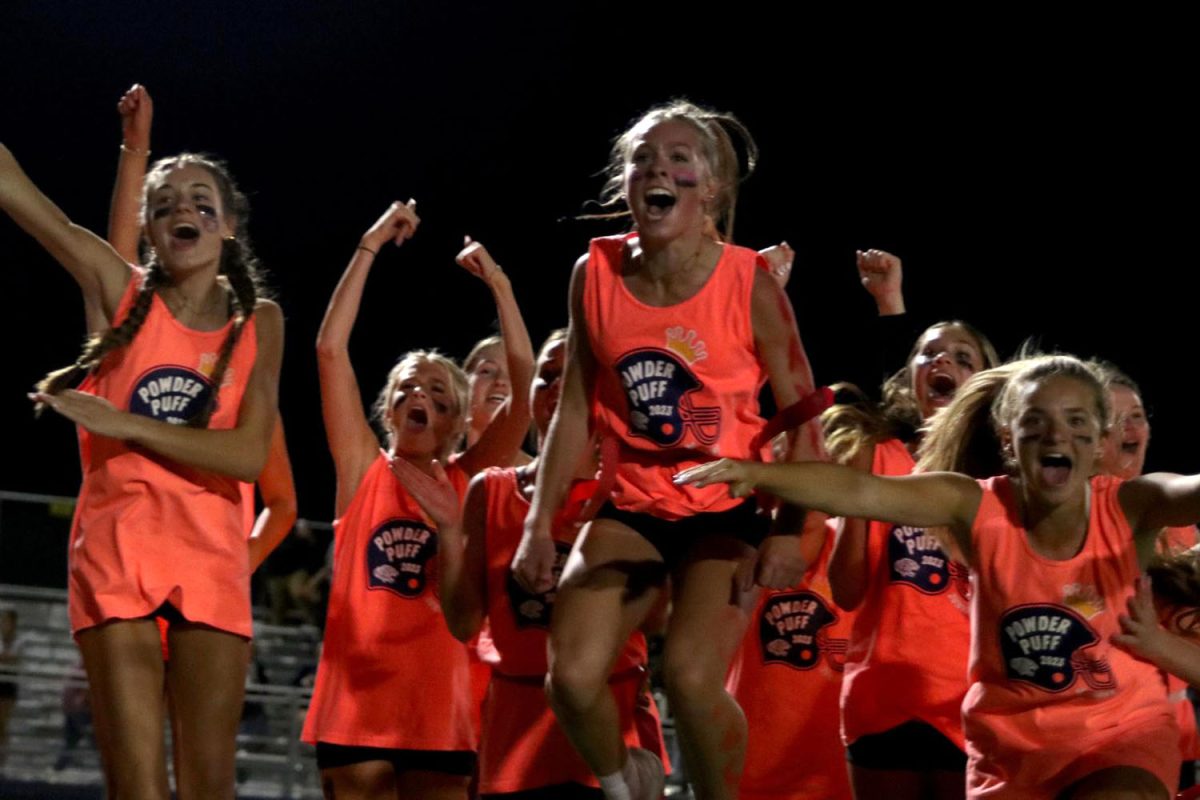 The Junior powderpuff team celebrates after a touchdown.