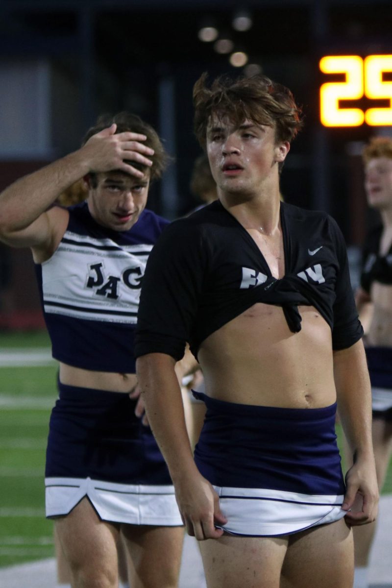 After an exhausting halftime show, Ryan Deverill and Gavin Johnson stand catching their breath. 