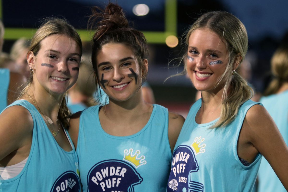 With big smiles senior Gracie Bowline, Abby Wolff and Makenna Payne celebrate their victory over the juniors.