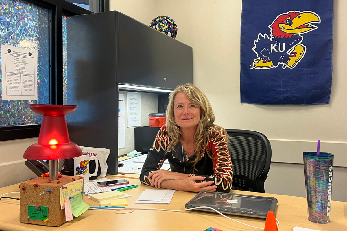 Gifted facilitator Michele Brown sits at her desk with her lamp Wednesday, Sep. 6. I walked by [the lamp] at Kohls years ago and Ive had it on my desk forever and its just that kids find it endlessly amusing, Brown said.