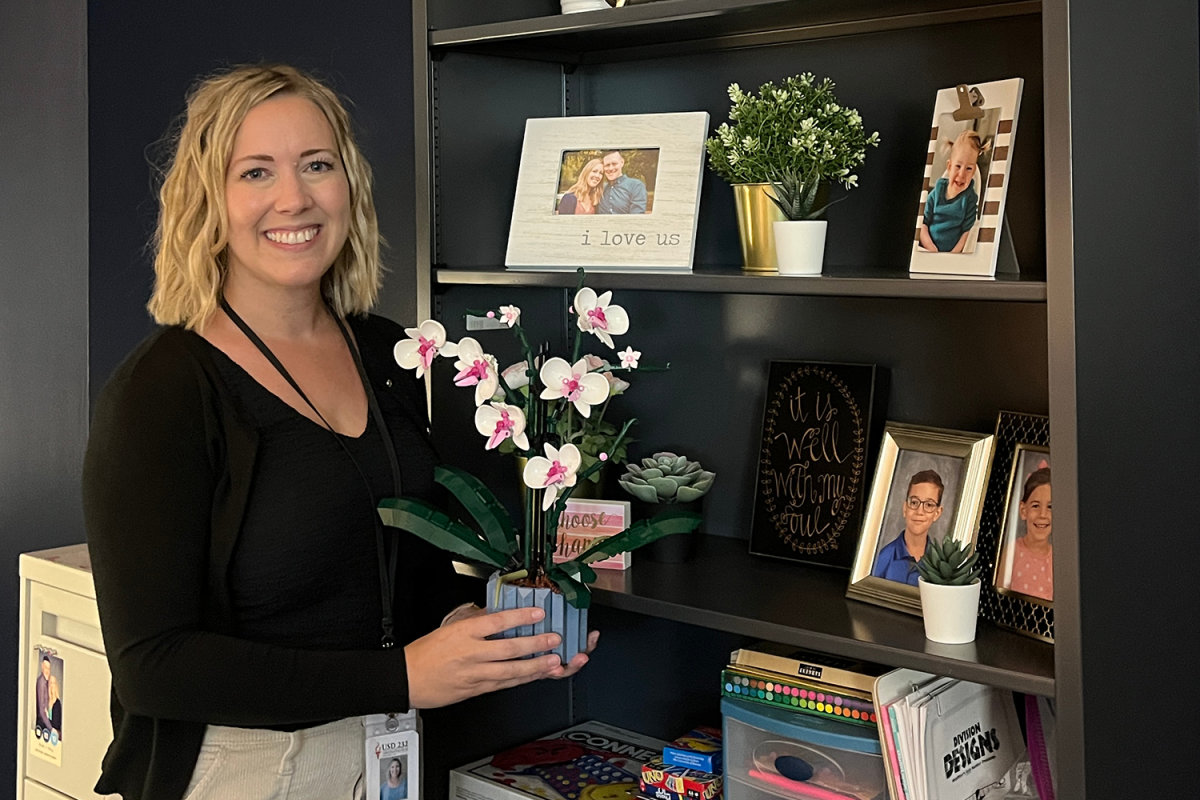 Newly hired school psychologist Stacy Miller poses with Lego flowers she and her son built together Monday, Sep. 4. “[They] remind me of our shared interest in Legos and how much I love my kids,” Miller said.