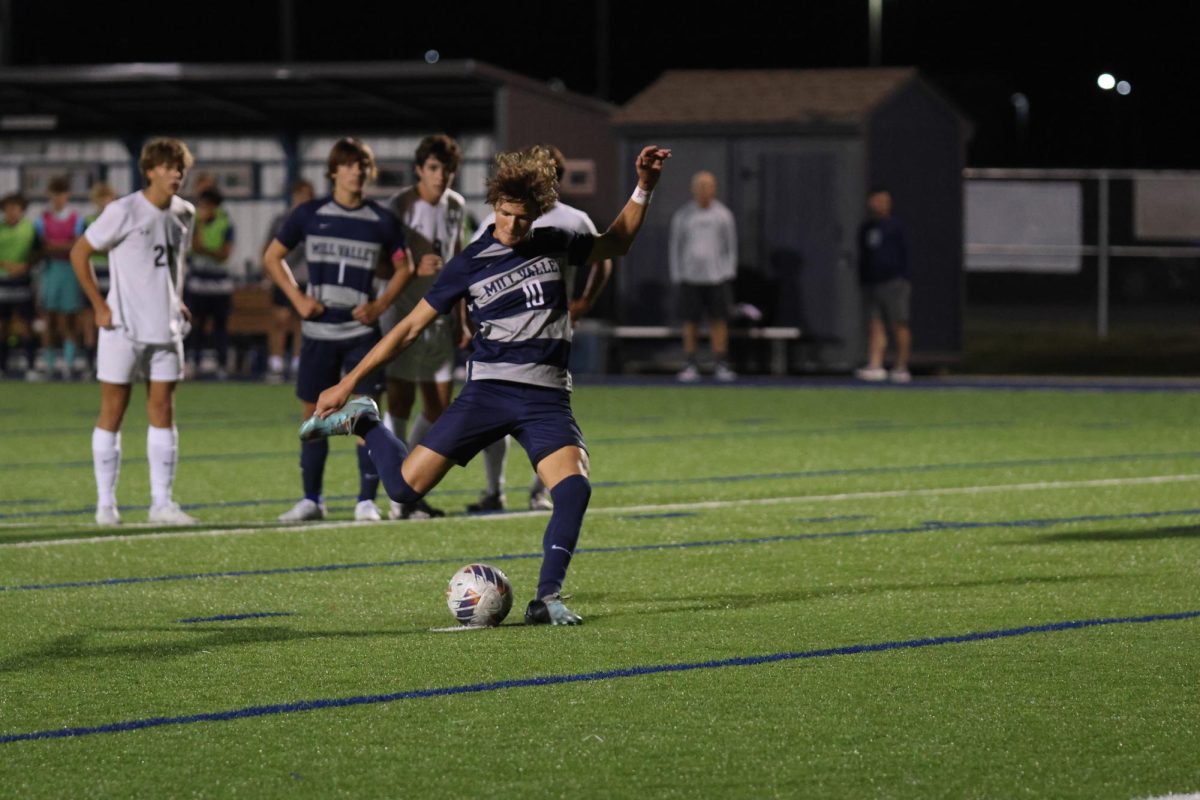 Shooting his penalty kick, junior Nic Schrag earns a goal back.