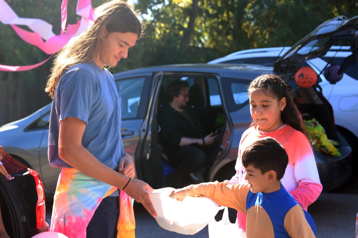 KCIA students peer into Sophomore Keegan Woottons candy bowl.