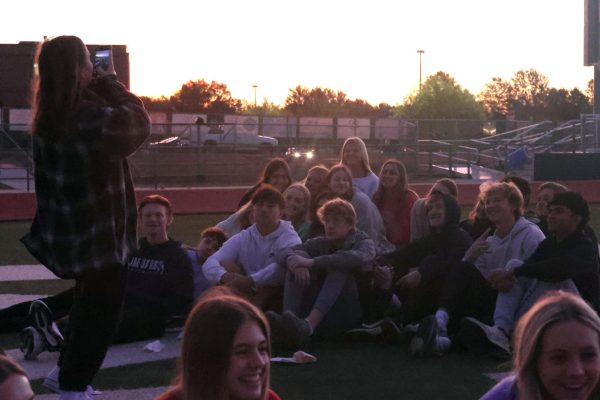 Posing for an instagram picture, StuCo members smile for the camera.