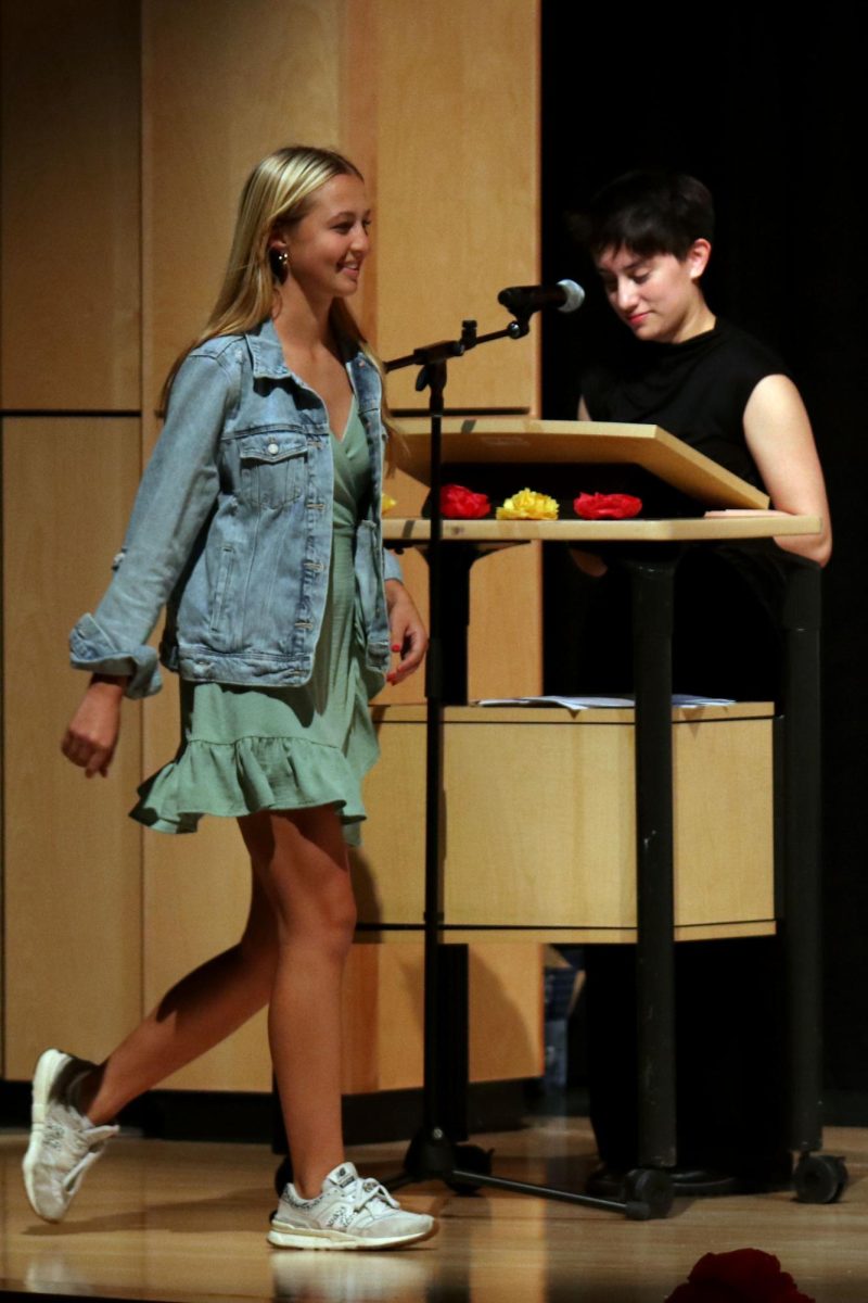 Smile on her face, junior Maggie Wieland walks proudly across the stage. 