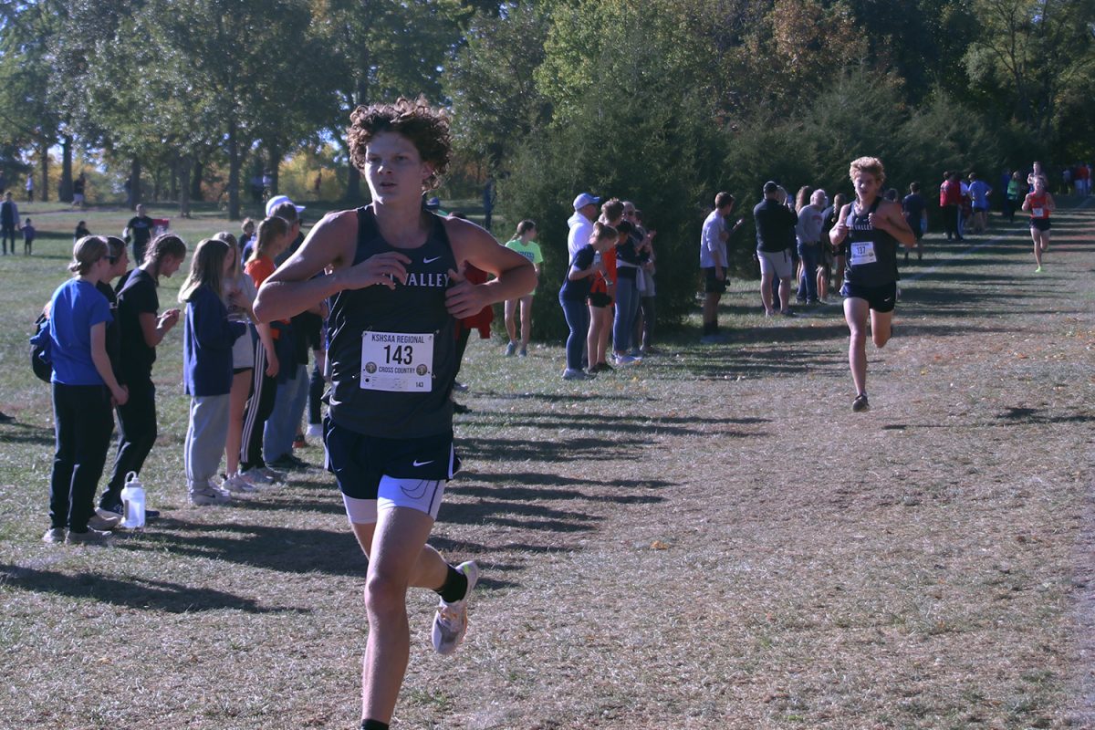 Lengthening his stride, sophomore Jordan Schierbaum races to the finish line.