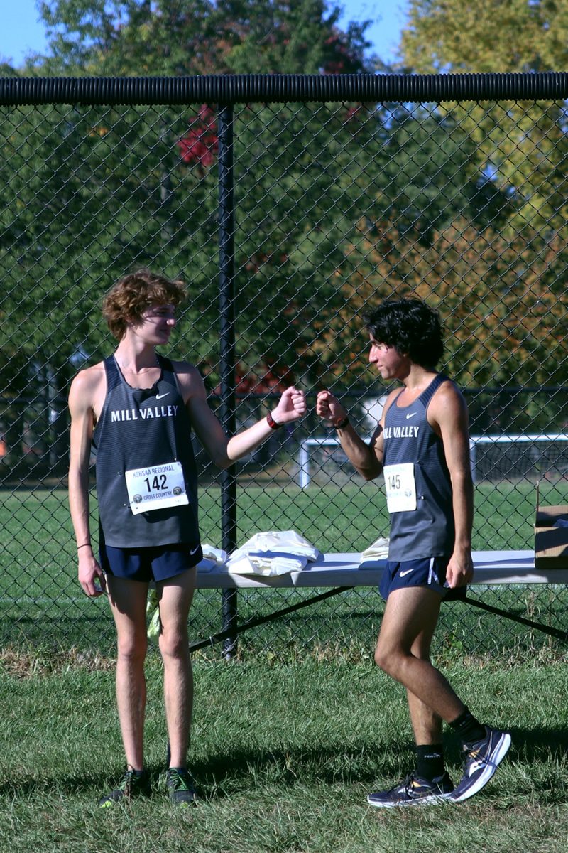 After receiving their medals, juniors Dalamar Read and Yazid Vazquez congratulate each other.